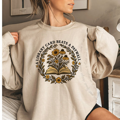 A Library Card Beats a Paywall Badge Care & Resist Gildan crewneck sweatshirt in Sand