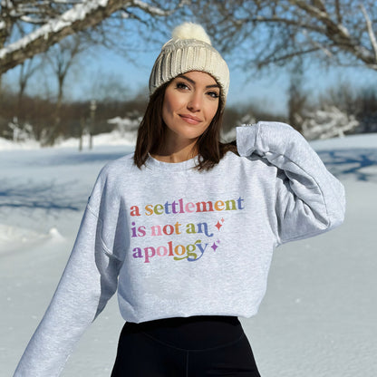 A Settlement is not an Apology Care & Resist Gildan crewneck sweatshirt in Sport Grey