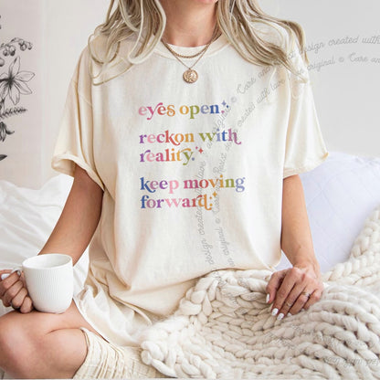Eyes Open. Reckon With Reality. Keep Moving Forward. Care & Resist progressive t-shirt in Ivory