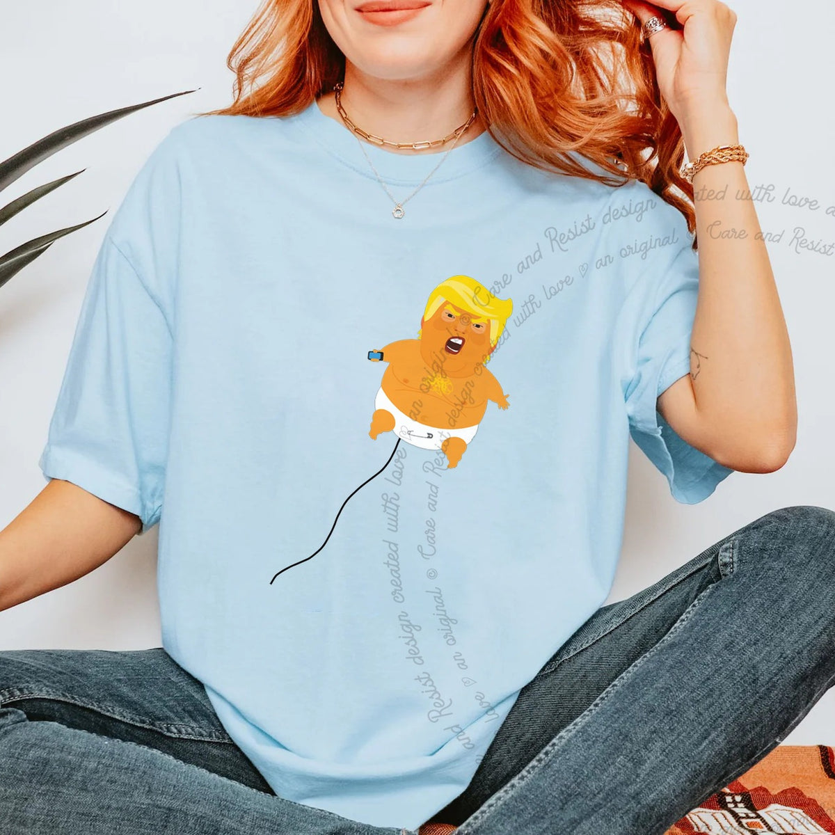Trump Baby Blimp Care & Resist progressive t-shirt in Chambray