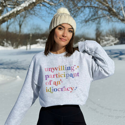 Unwilling Participant of an Idiocracy Care & Resist Gildan crewneck sweatshirt in Sport Grey