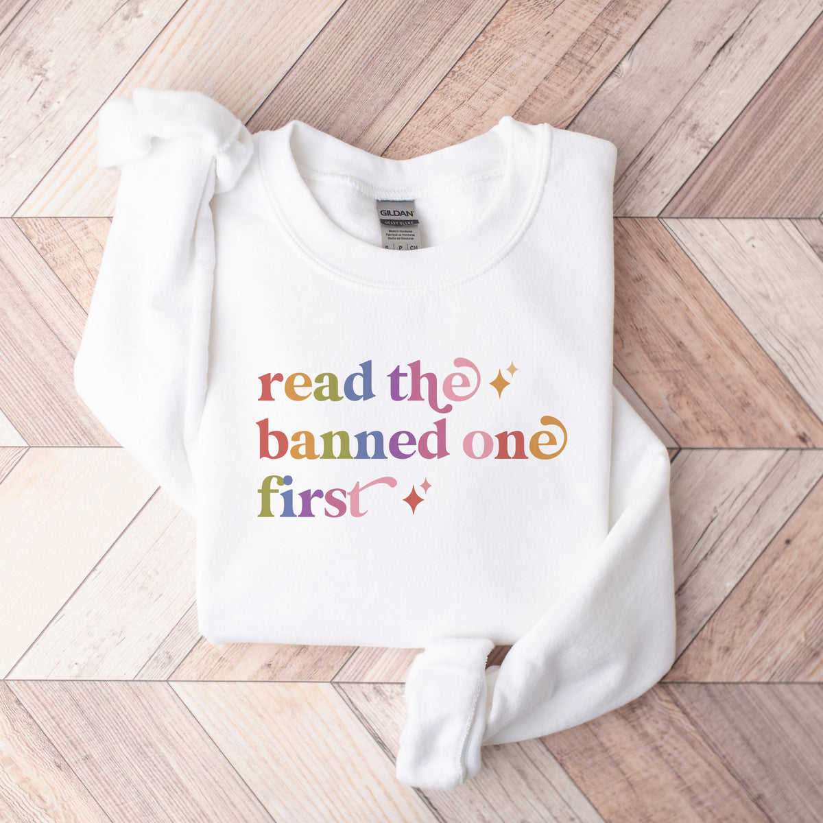 Read the Banned One First Care & Resist Gildan crewneck sweatshirt in White
