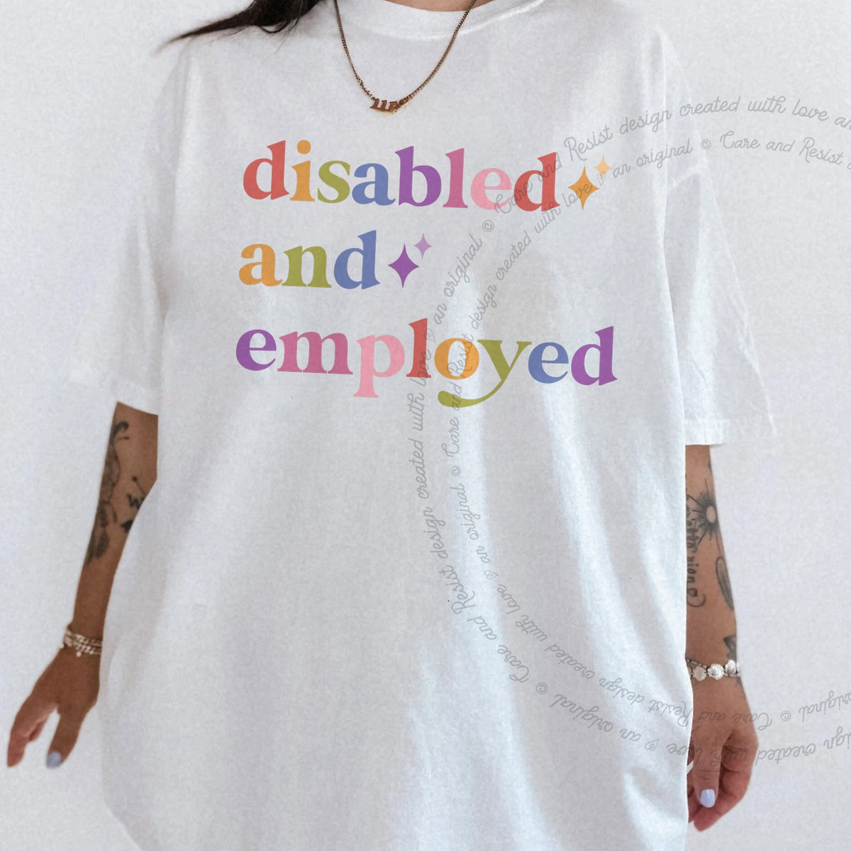 Disabled and Employed Care & Resist rainbow tee