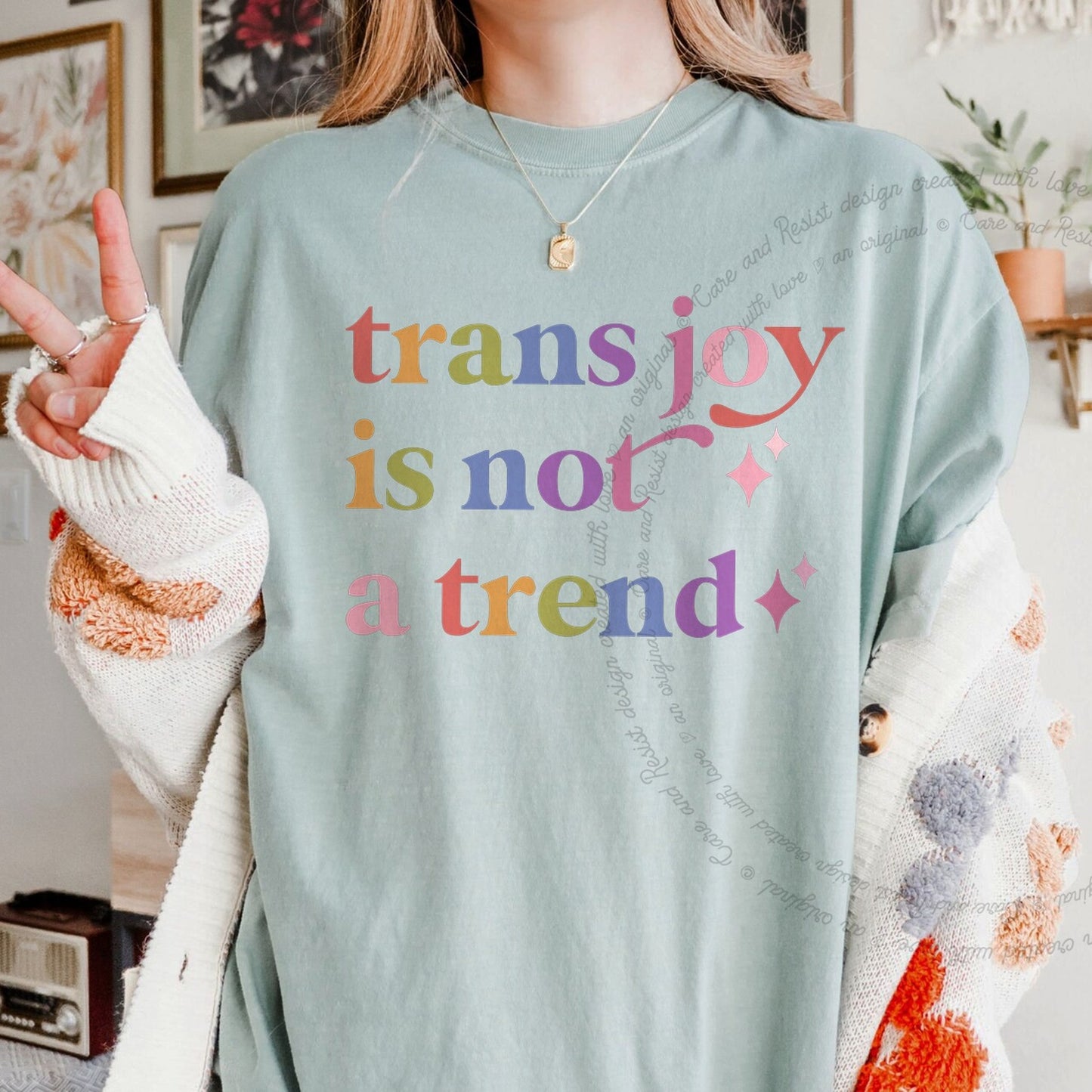 Trans Joy is not a Trend Care & Resist rainbow Comfort Colors tee, Bay