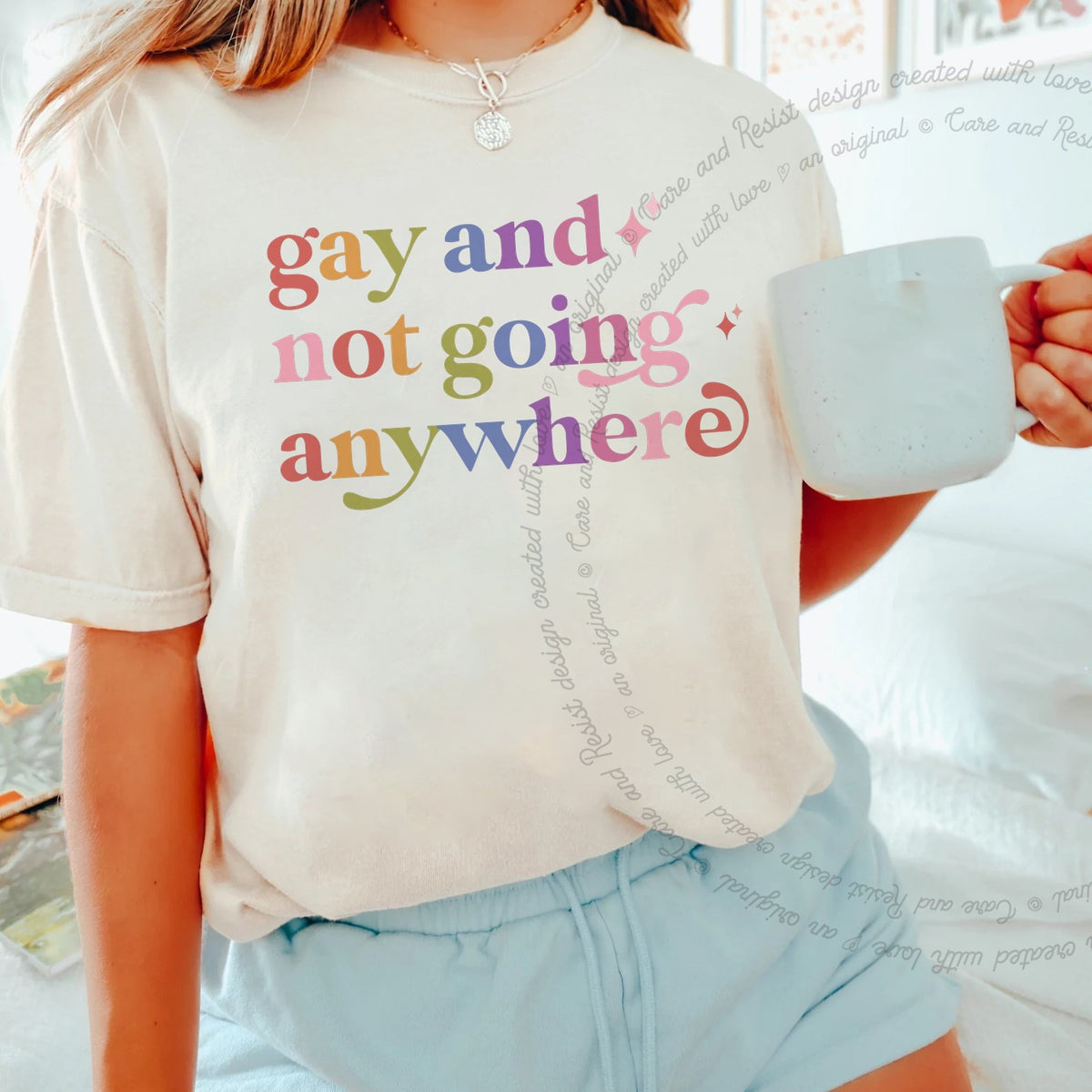 Gay and not Going Anywhere Care & Resist rainbow tee