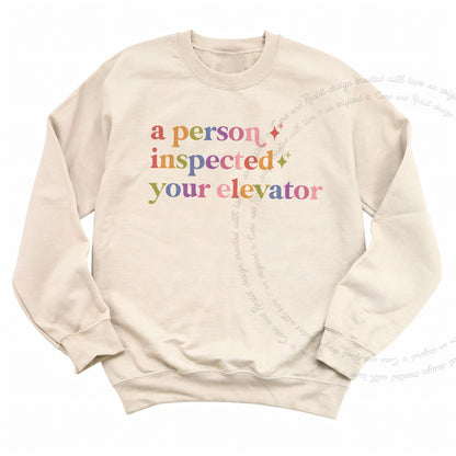 A Person Inspected Your Elevator Care & Resist Gildan crewneck sweatshirt in Sand