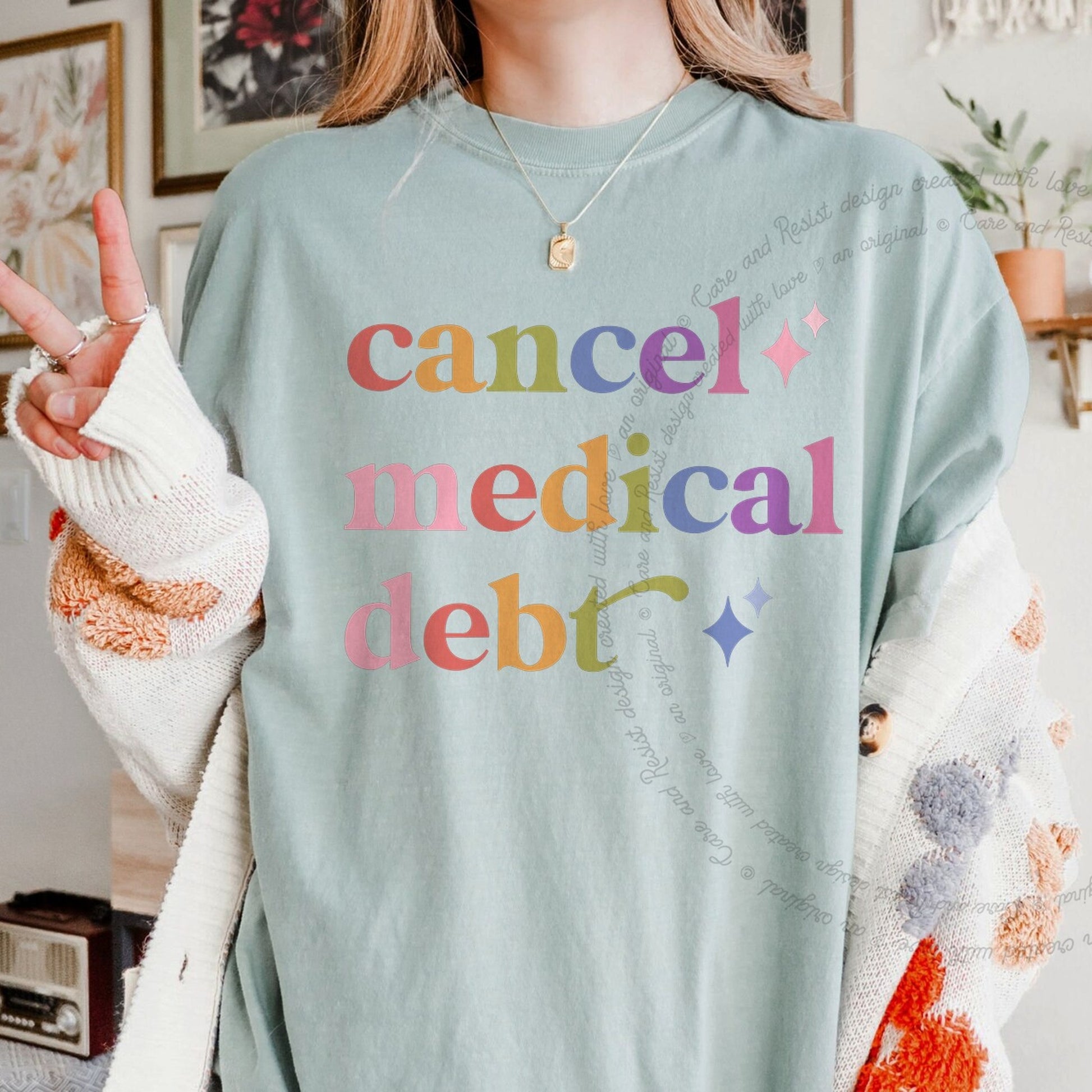 Cancel Medical Debt Care & Resist rainbow Comfort Colors tee, Bay