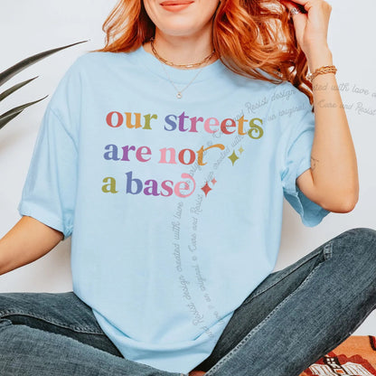 Our Streets are not a Base Care & Resist rainbow tee