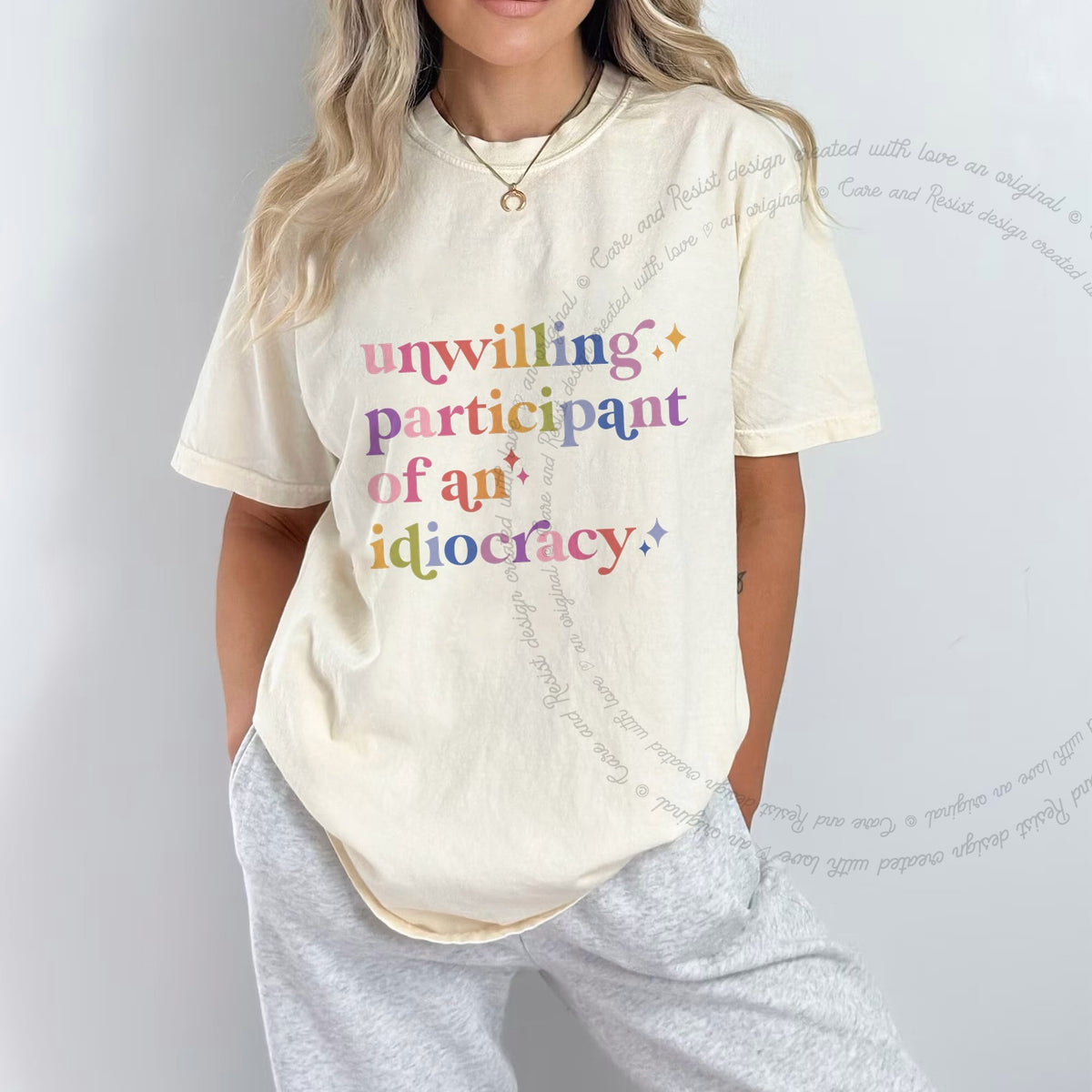 Unwilling Participant of an Idiocracy Care & Resist progressive t-shirt in Ivory