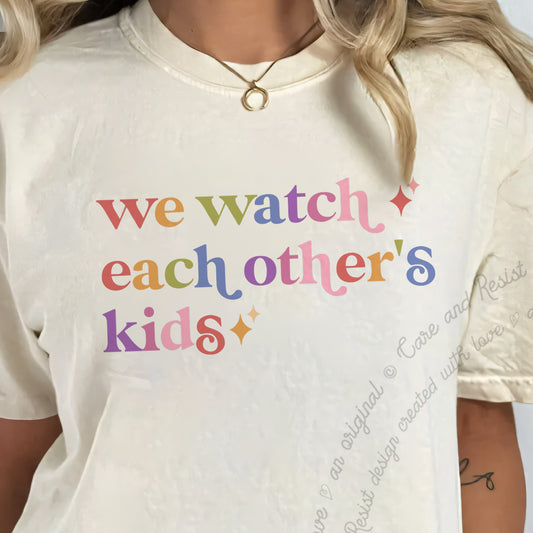 We Watch Each Other's Kids Care & Resist progressive t-shirt in Ivory