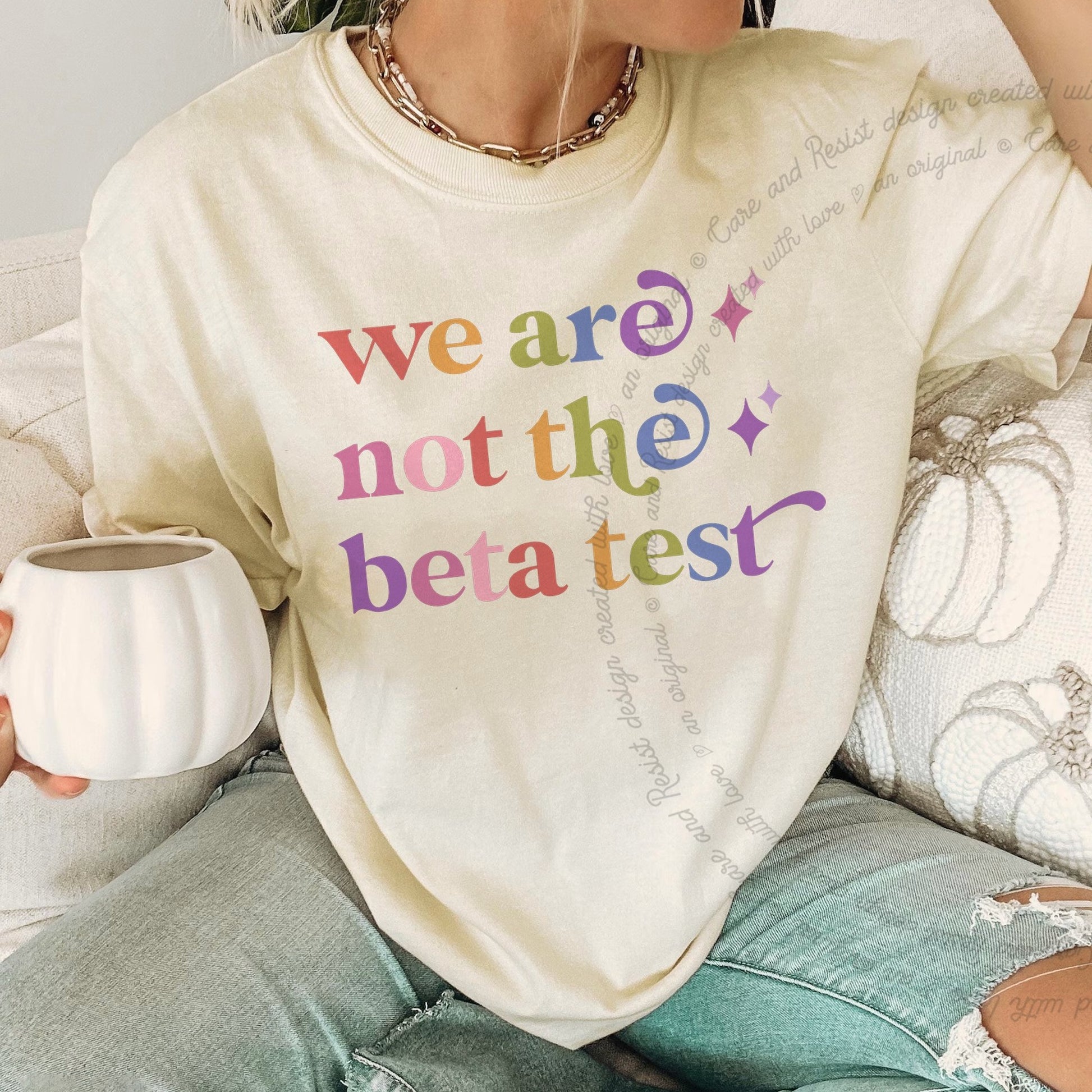 We are not the Beta Test Care & Resist rainbow Comfort Colors tee, Ivory