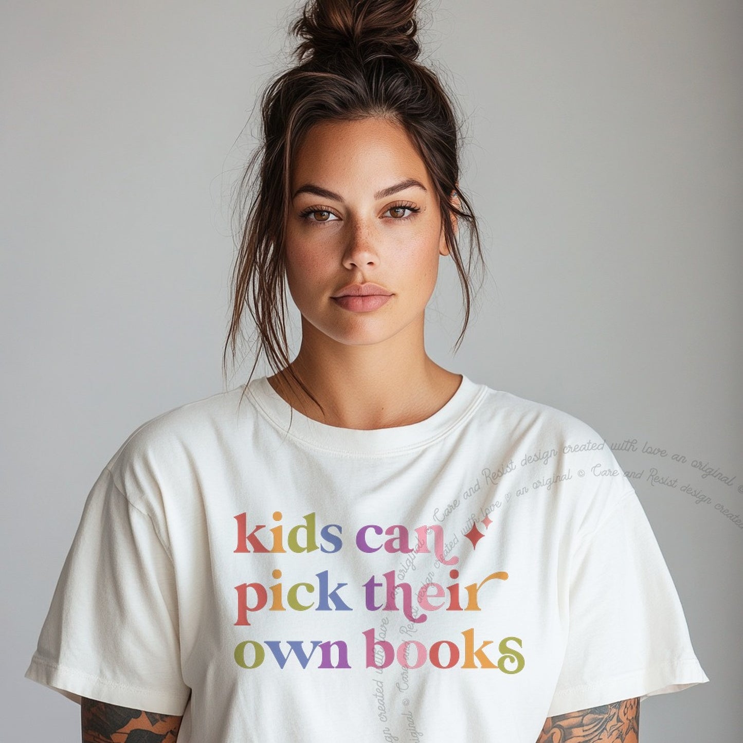 Kids Can Pick Their Own Books Care & Resist rainbow Comfort Colors tee, White