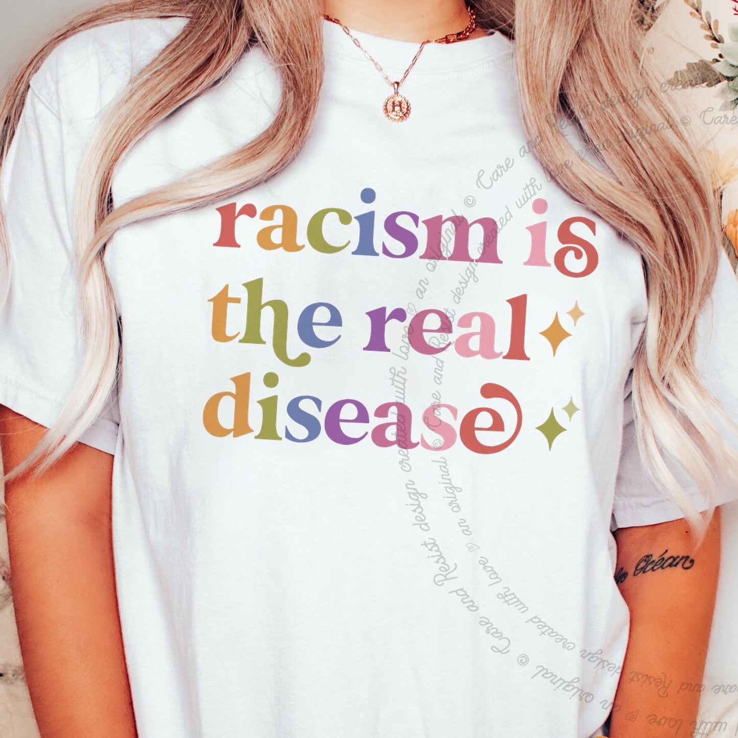 Racism is the Real Disease Care & Resist rainbow Comfort Colors tee, White