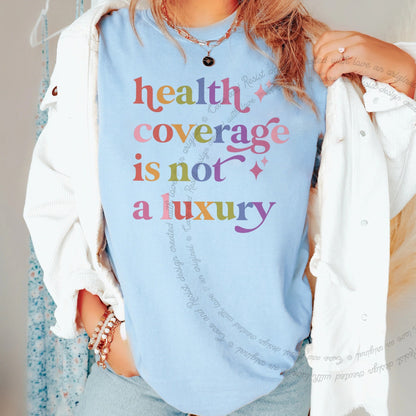 Health Coverage is not a Luxury Care & Resist rainbow Comfort Colors tee, Chambray