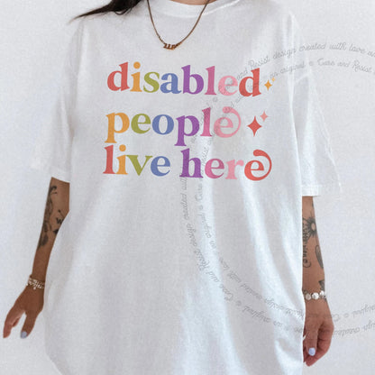 Disabled People Live Here Care & Resist rainbow tee