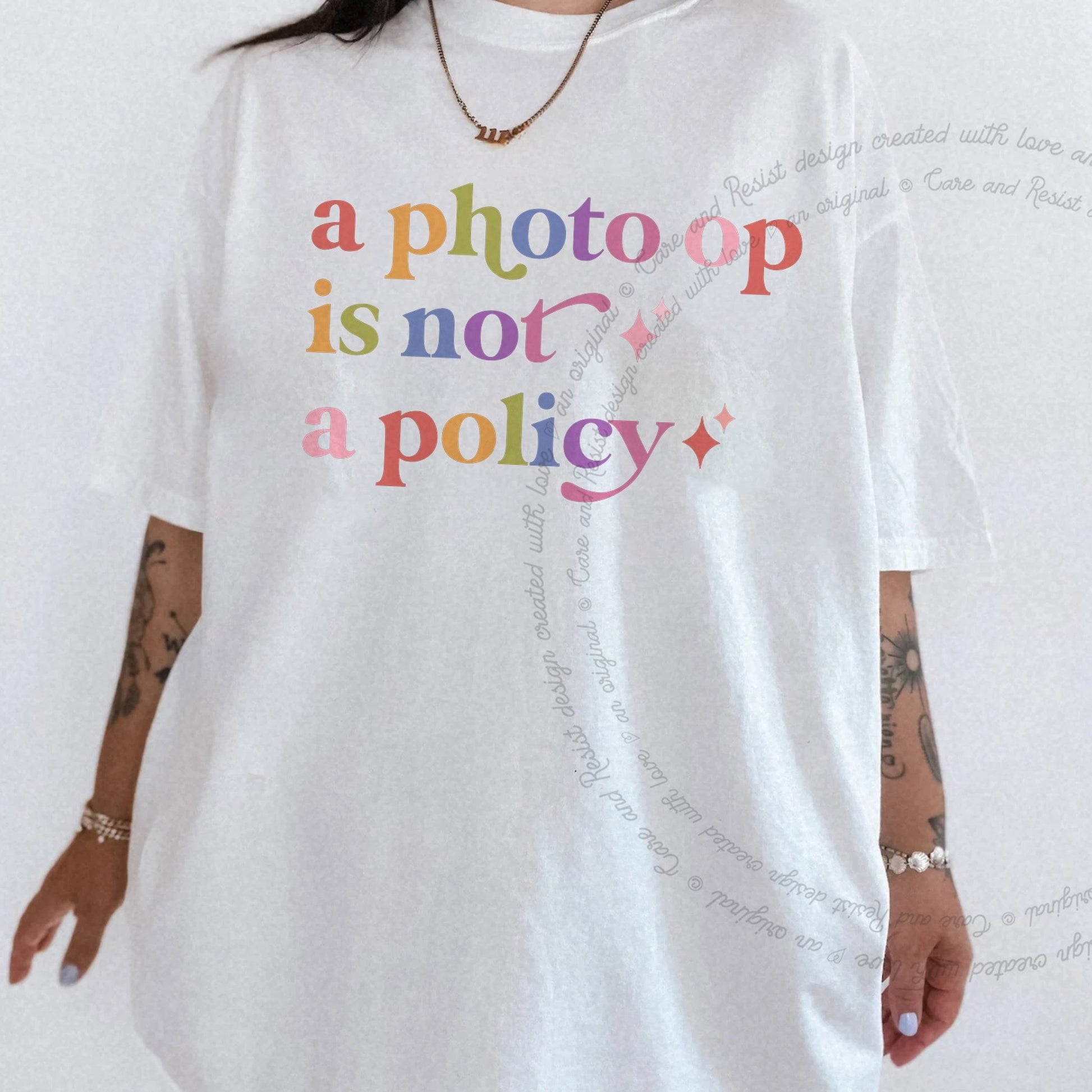 A Photo Op is not a Policy Care & Resist rainbow tee