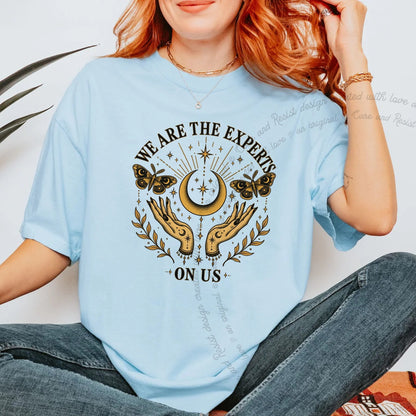 We are the Experts on Us Celestial Care & Resist progressive t-shirt in Chambray