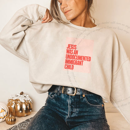 Jesus Was an Undocumented Immigrant Child Care & Resist Gildan crewneck sweatshirt in Sand