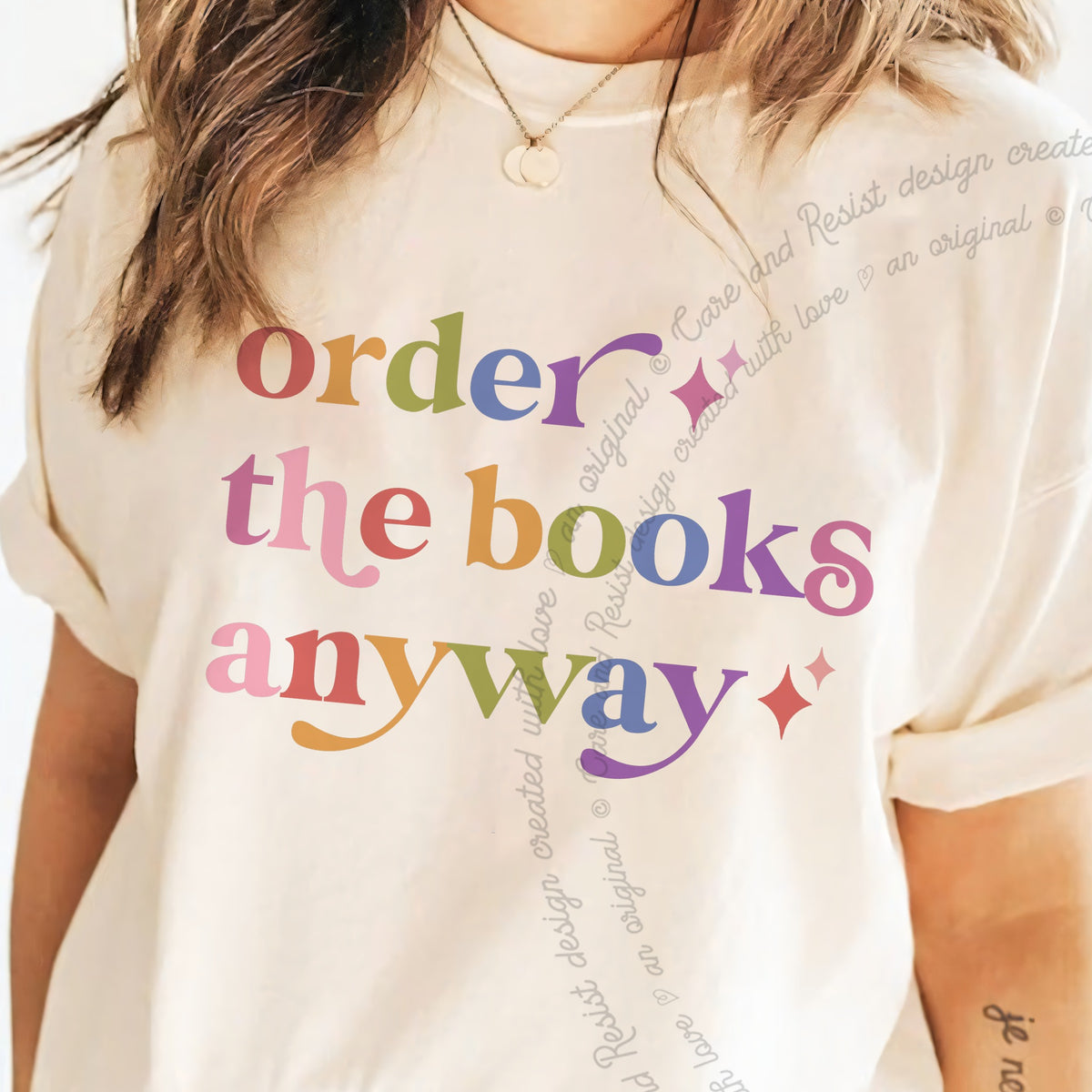 Order the Books Anyway Care & Resist progressive t-shirt in Ivory