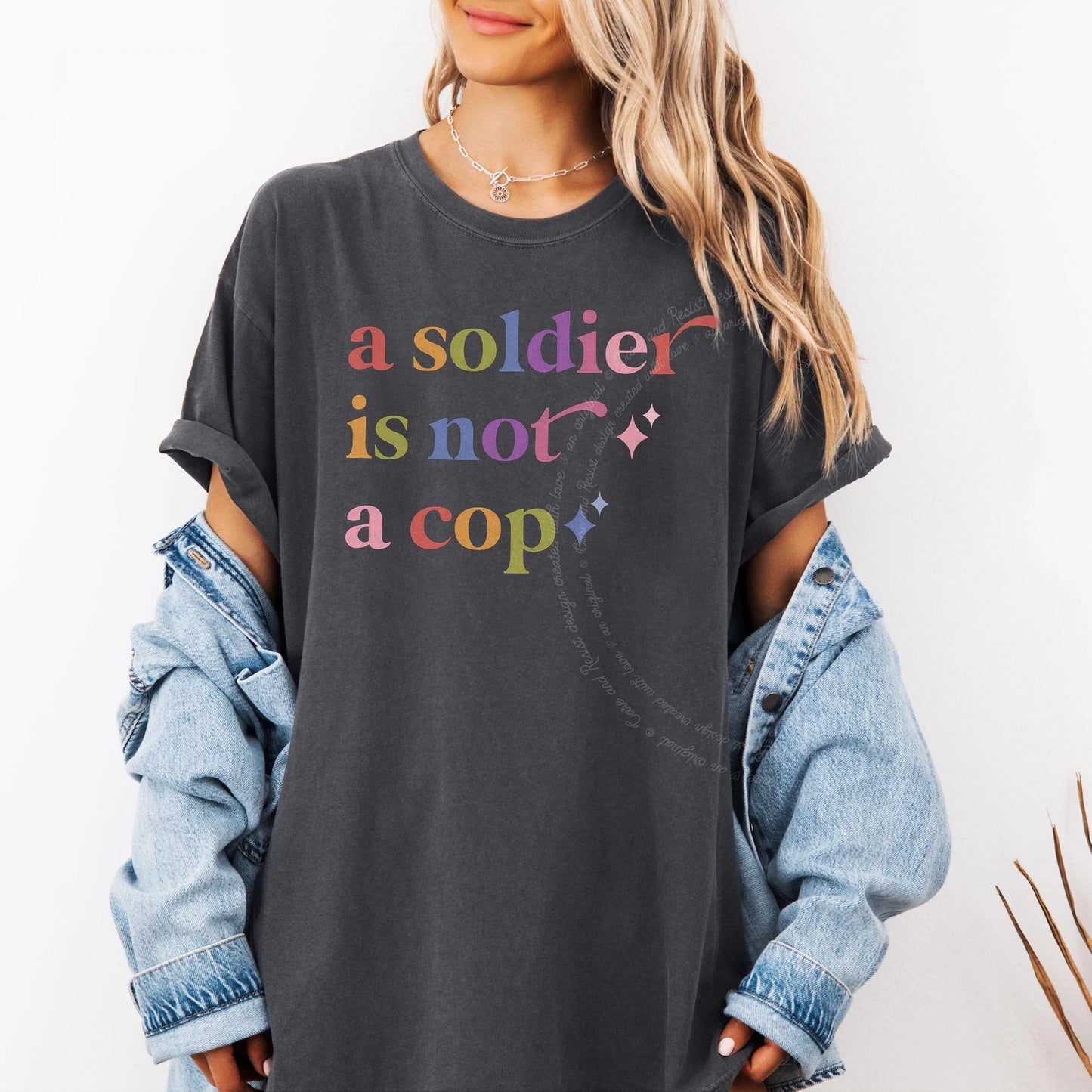 A Soldier is not a Cop Care & Resist rainbow tee