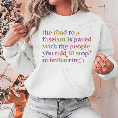 The Road to Fascism Is Paved With the People You Told to Stop Overreacting Care & Resist Gildan crewneck sweatshirt in White