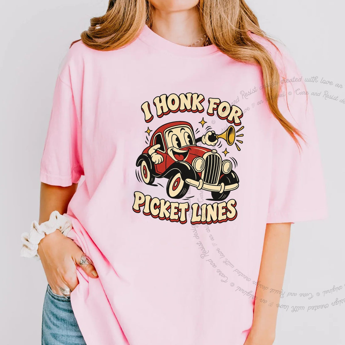 I Honk for Picket Lines Cartoon Care & Resist progressive t-shirt in Blossom