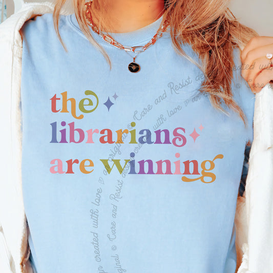 The Librarians are Winning Care & Resist progressive t-shirt in Chambray