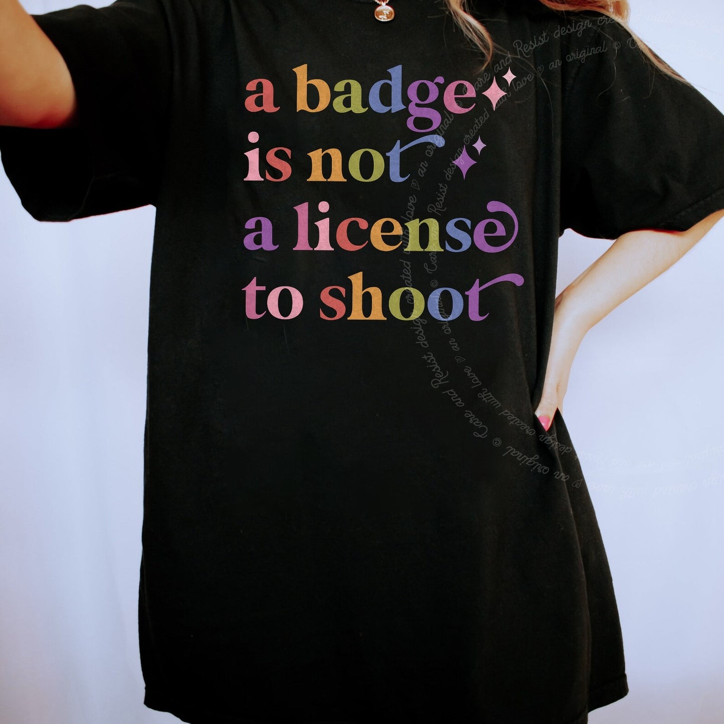 A Badge is not a License to Shoot Care & Resist rainbow Comfort Colors tee, Black