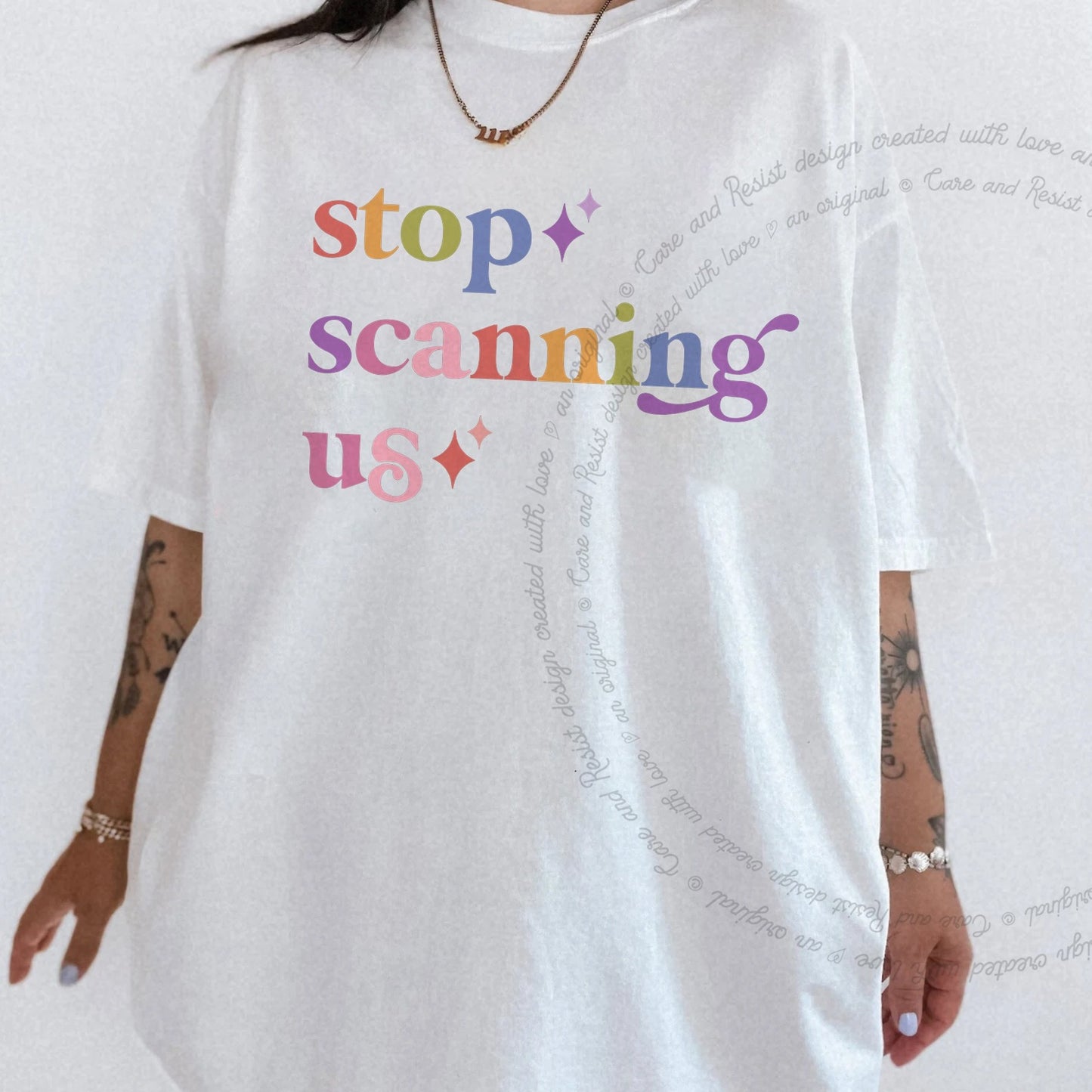 Stop Scanning Us Care & Resist rainbow Comfort Colors tee, White