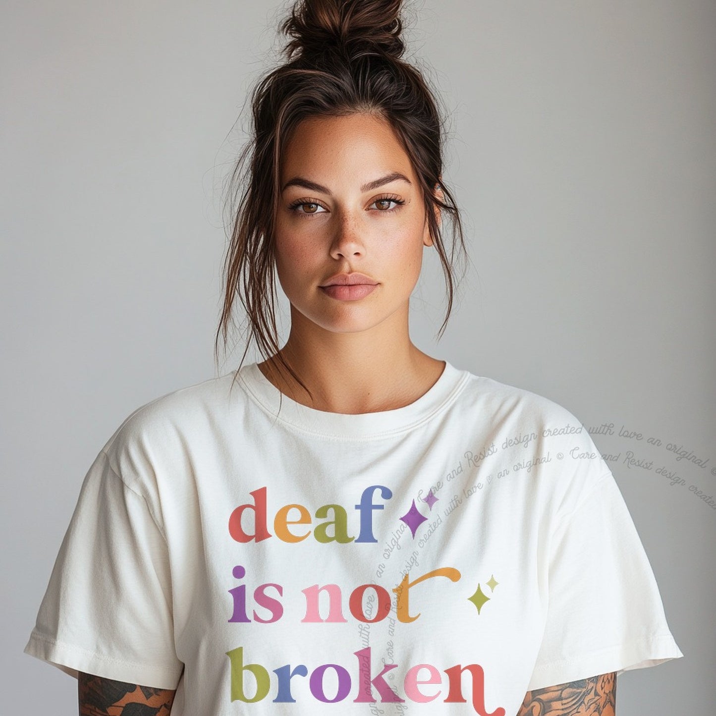 Deaf is not Broken Care & Resist rainbow tee
