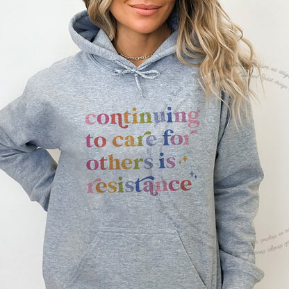 Continuing to Care for Others Is Resistance Care & Resist Gildan hoodie in Sport Grey