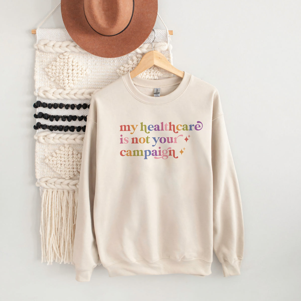 My Healthcare is not Your Campaign Care & Resist Gildan crewneck sweatshirt in Sand