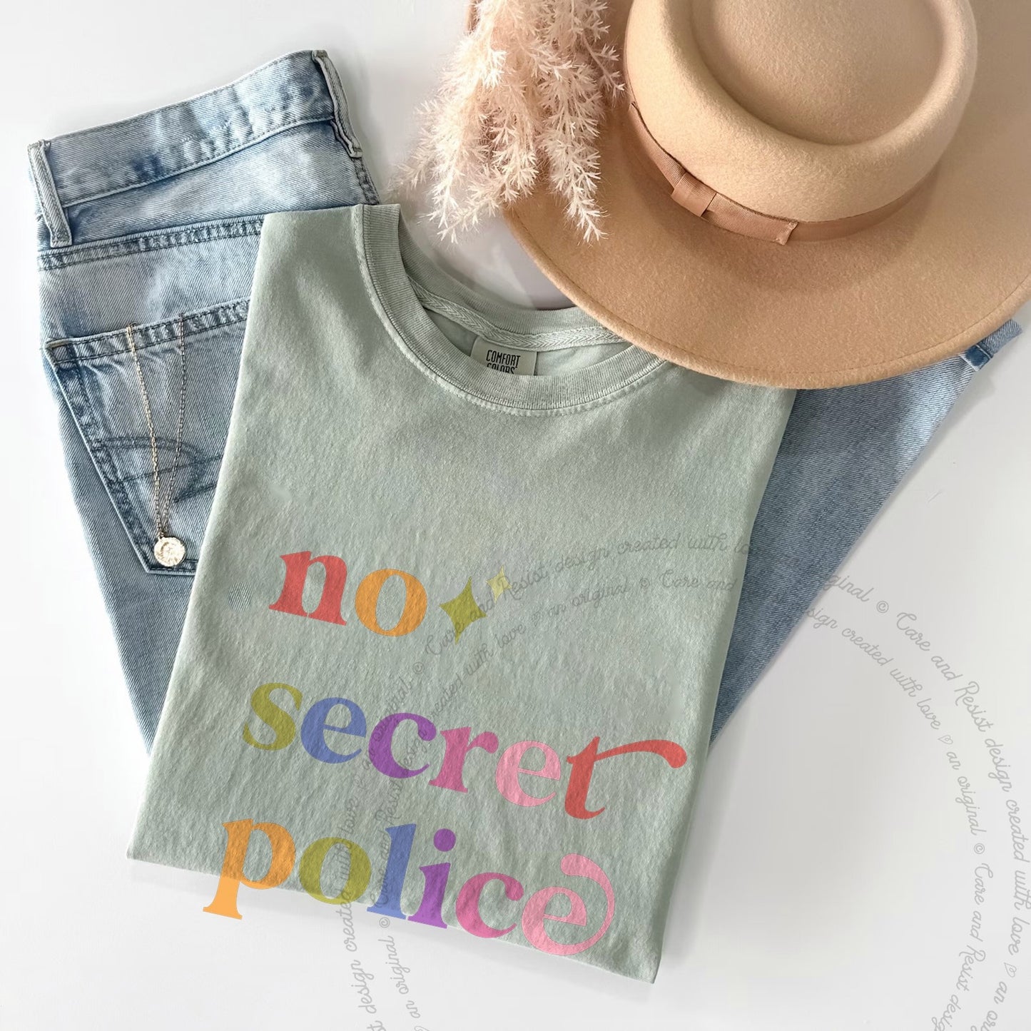 No Secret Police Care & Resist rainbow Comfort Colors tee, Bay