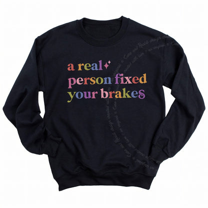 A Real Person Fixed Your Brakes Care & Resist Gildan crewneck sweatshirt in Black
