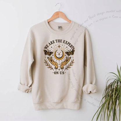 We are the Experts on Us Celestial Care & Resist Gildan crewneck sweatshirt in Sand