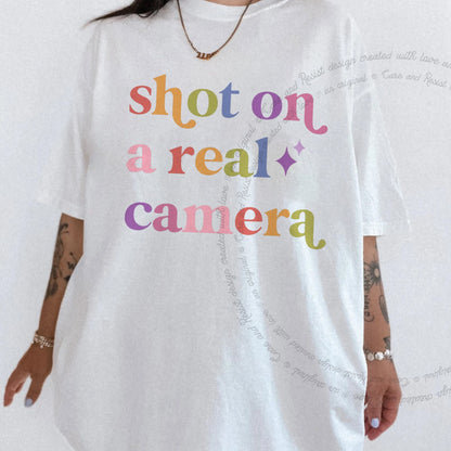 Shot on a Real Camera Care & Resist rainbow tee