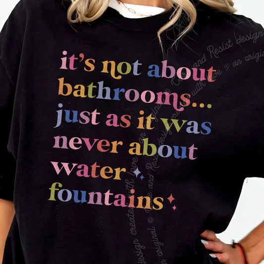 Its Not About Bathrooms Care & Resist tee in Black, close-up of the lettering