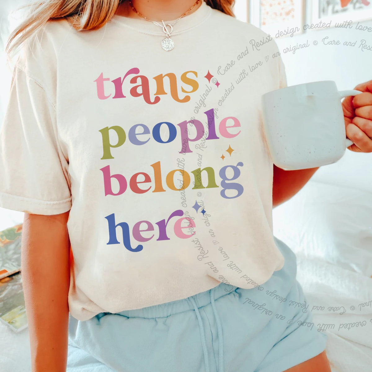Trans People Belong Here Care & Resist progressive t-shirt in Ivory