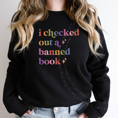 I Checked Out a Banned Book Care & Resist Gildan crewneck sweatshirt in Black