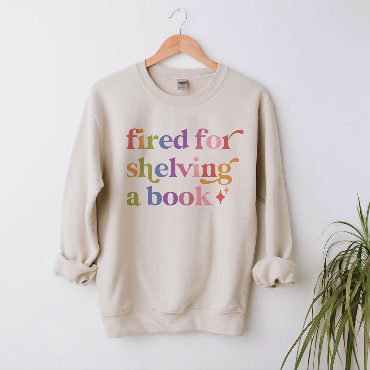 Fired for Shelving a Book Care & Resist Gildan crewneck sweatshirt in Sand