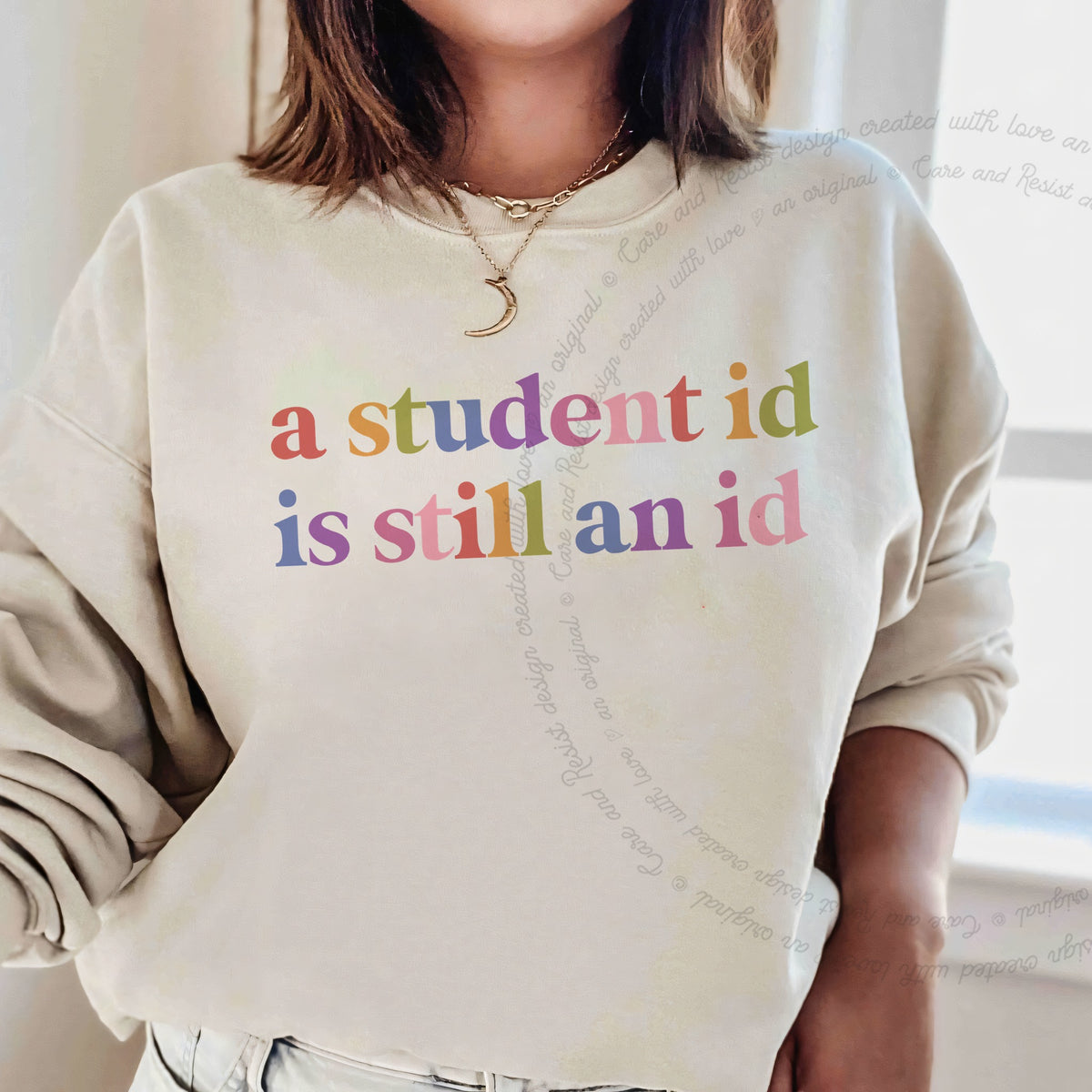 A Student Id is Still an Id Care & Resist Gildan crewneck sweatshirt in Sand