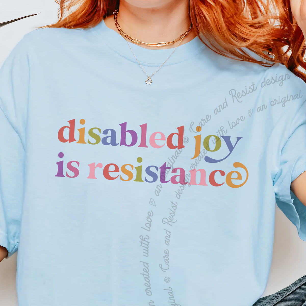 Disabled Joy is Resistance Care & Resist progressive t-shirt in Chambray