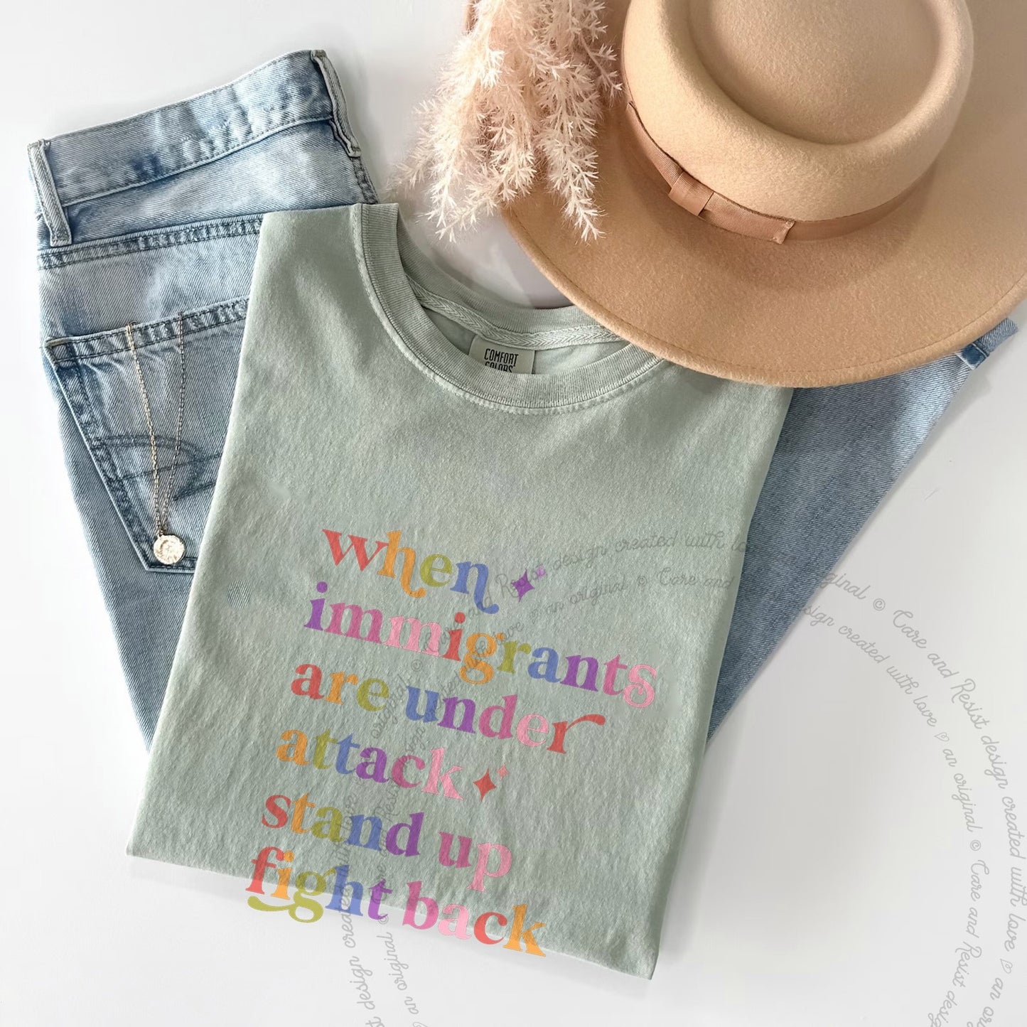 When Immigrants are Under Attack Care & Resist rainbow Comfort Colors tee, Bay
