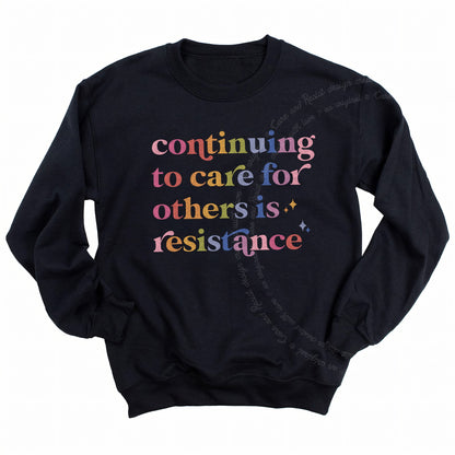 Continuing to Care for Others Is Resistance Care & Resist Gildan crewneck sweatshirt in Black