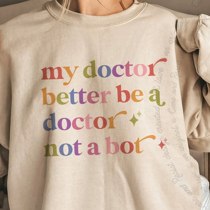 My Doctor Better Be a Doctor not a Bot Care & Resist Gildan crewneck sweatshirt in Sand