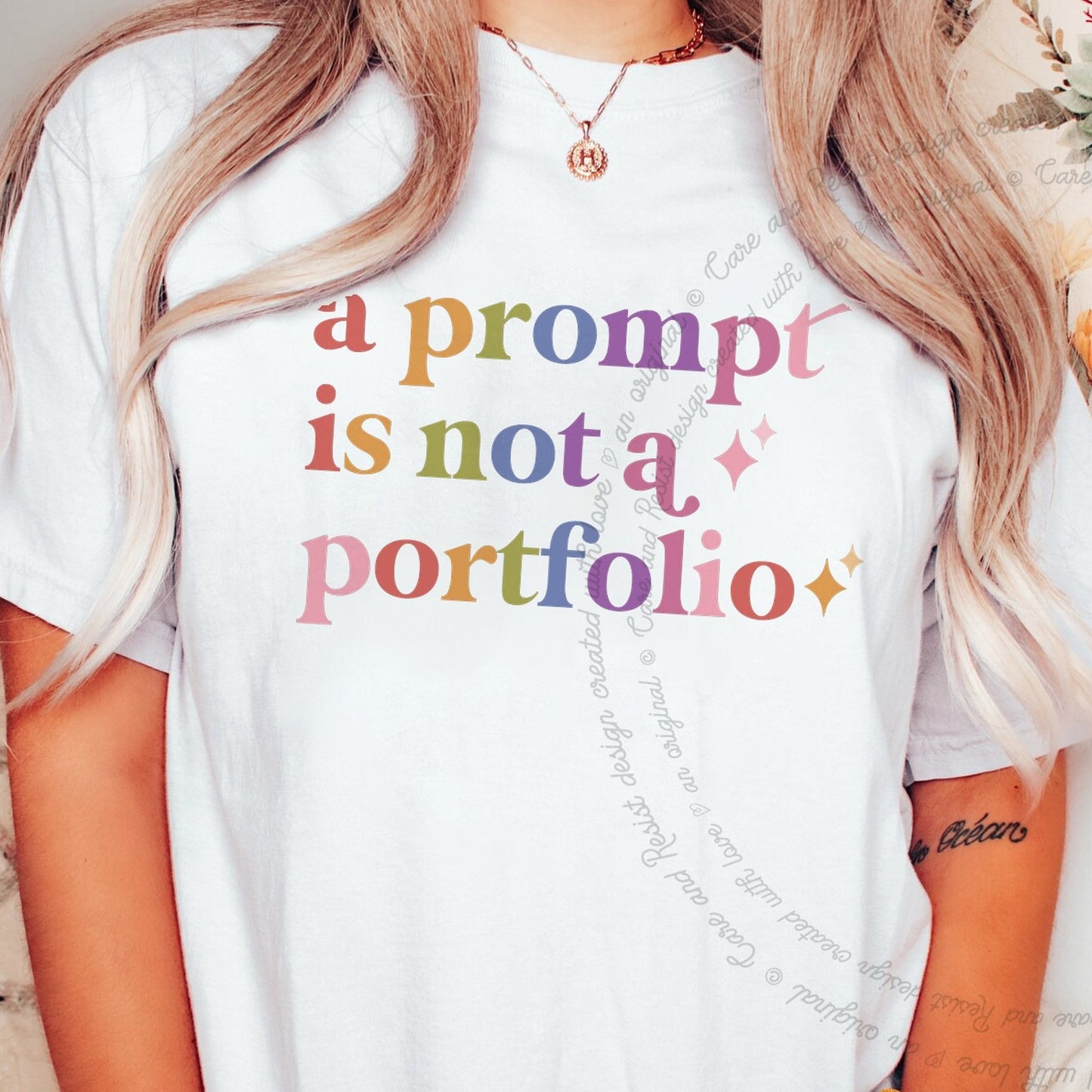 A Prompt is not a Portfolio Care & Resist rainbow tee