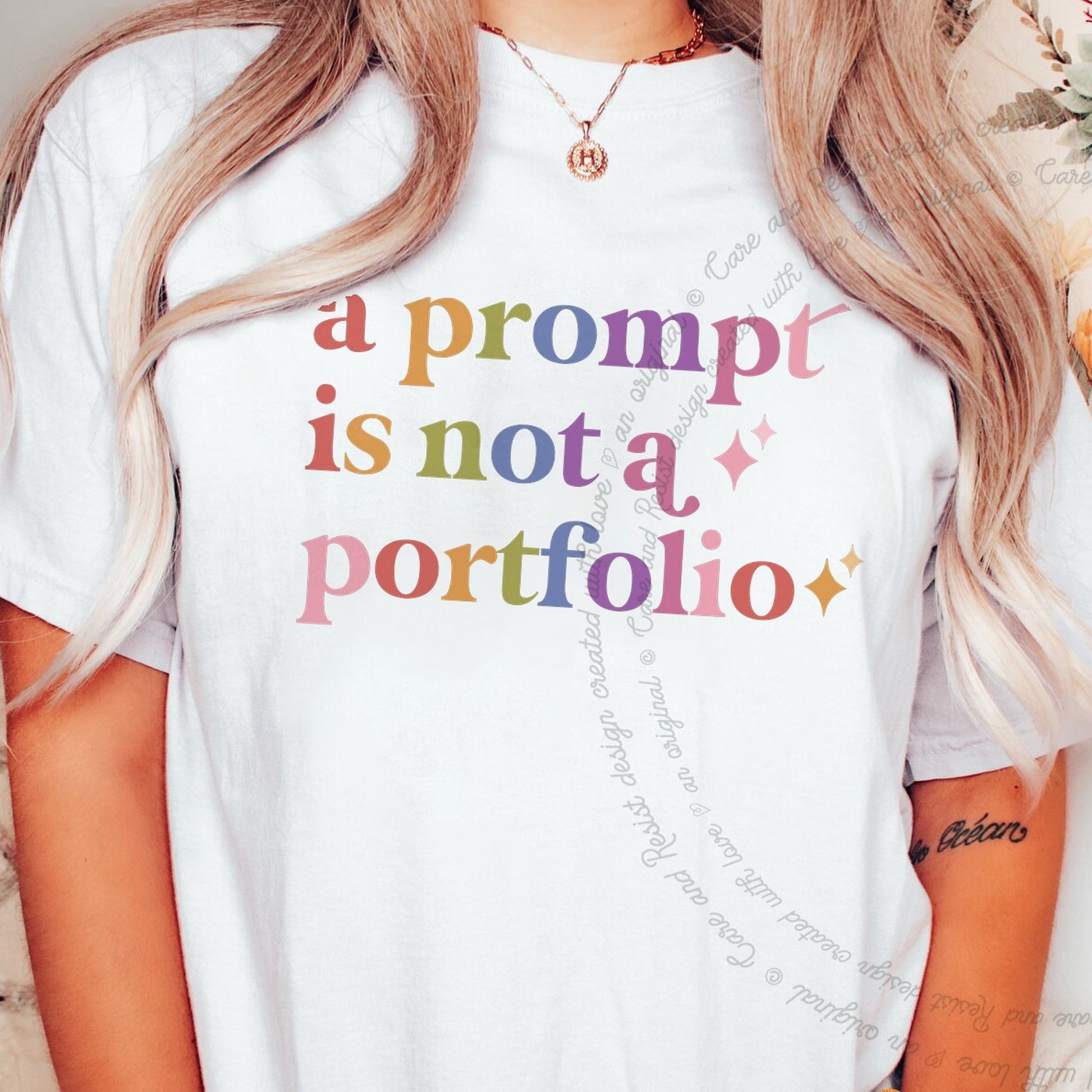 A Prompt is not a Portfolio Care & Resist rainbow tee