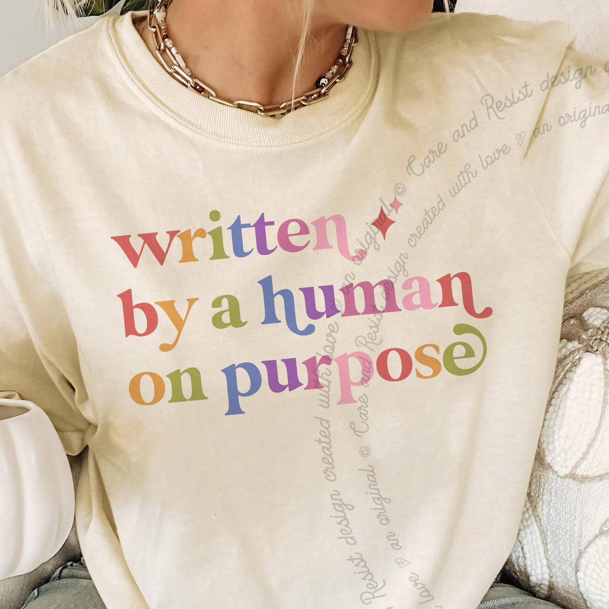 Written By a Human on Purpose Care & Resist progressive t-shirt in Ivory