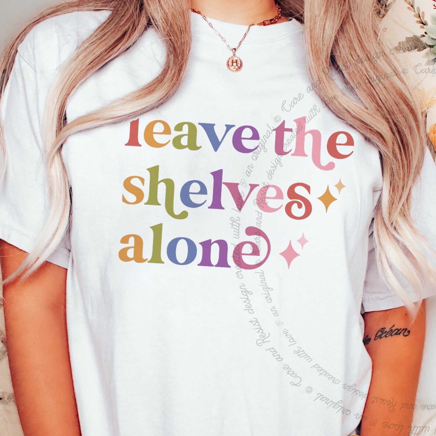 Leave the Shelves Alone Care & Resist rainbow tee