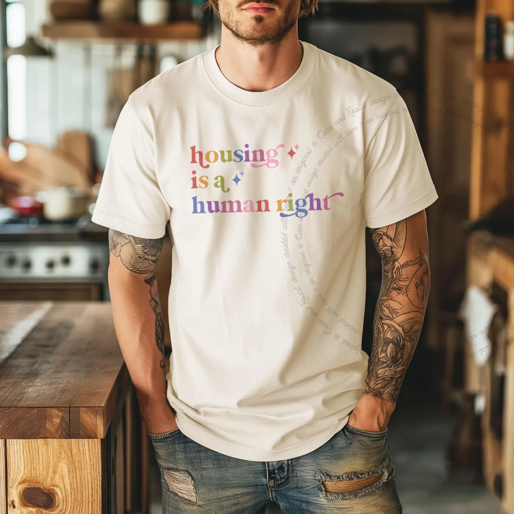 Housing is a Human Right Care & Resist rainbow Comfort Colors tee, Ivory